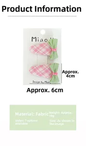 Vue détaillée des barrettes à cheveux en tissu écossais rose avec les dimensions