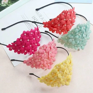 Floral girls hairbands with pearls in five colors like red and yellow on a white page