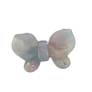 Gradient butterfly hair clip with acetate marbling and rhinestones on white background