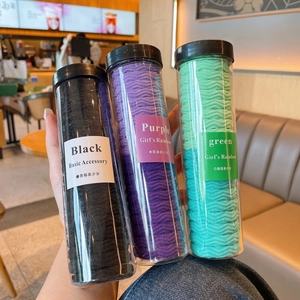 Kids wavy elastic hair ties in portable tubes featuring black, purple and green colors