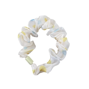Sweet satin scrunchie with colorful polka dots and light green decorative buckle
