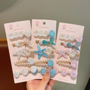 Détails du lot de barrettes à cheveux thème marin avec étoiles de mer et coquillages