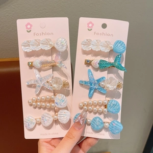 Set de barrettes thème océan avec étoiles de mer, coquillages et perles bleu et blanc