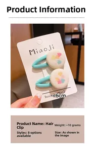 Close-up of blue plaid hair clips with heart button detail on white display card