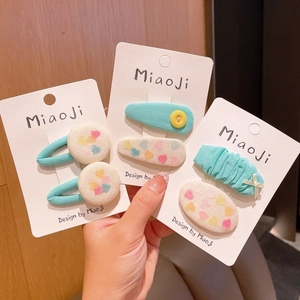 Three-piece girls mint green plaid bow hair clip set with hearts and buttons decoration