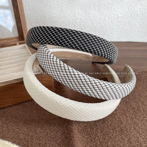 Three premium wide sponge headbands in houndstooth and solid fabric textures