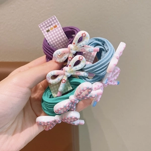 Three-pack candy colored bow hair ties with floral patterns and high elastic ropes
