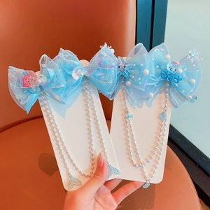 Detailed blue bow hair clip with mermaid charms, pearls and long tassels for girls