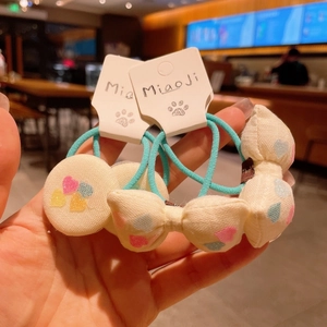 Handmade fabric hair scrunchies with colorful hearts and pearl bow detail for girls