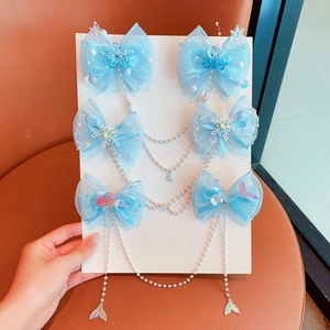 Light blue butterfly hair clips set with pearls and ocean charms for girls styling