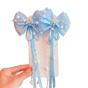 Pair of light blue butterfly hair clips with long pearl tassels and mesh ribbons