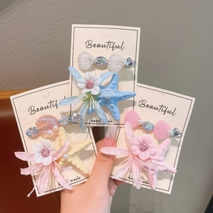 Handmade starfish and flower hair clips set in colorful ocean style for summer beach vacations