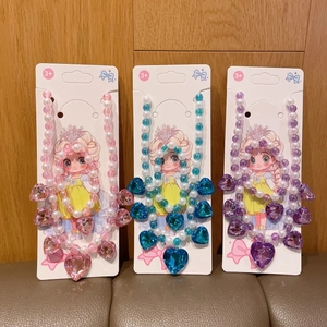 Three sets of beaded heart necklaces and bracelets for girls in pink, blue, and purple