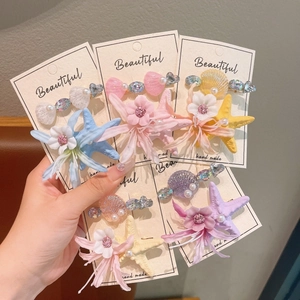 Five-piece ocean-themed starfish and flower hair clip set in vibrant macaron colors