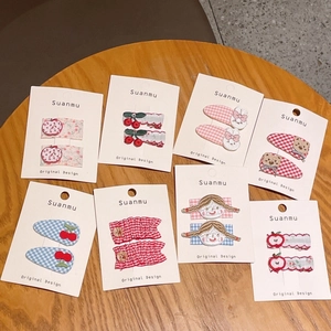 Cute children hair clip set featuring embroidered bears and cherries on checkered fabric