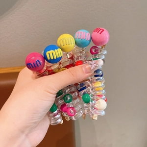 Colorful spiral hair ties with m-letter bubble beads for kids high pony hairstyles