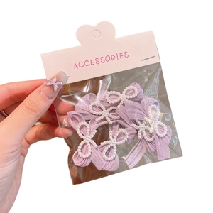 Five-piece set of purple ribbon bow hair clips with pearl accents for girls and women