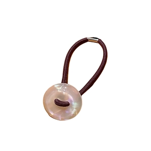 Minimalist high elasticity hair tie with a pearlescent round charm on a white background