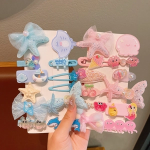 Mermaid and seashell themed glitter hair clip set for girls in various pastel colors