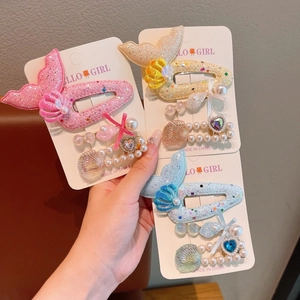 Cute ocean theme hair clips set for girls featuring glitter fish tail and shells decor