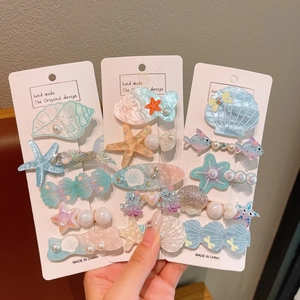 Mermaid ocean shell hair clip set with pearls and starfish on display card
