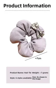 Detail view of purple floral cotton bow scrunchie showing 7cm size and soft texture