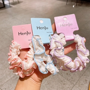 Three-piece floral chiffon hair scrunchies in pink, blue, and purple with card packaging
