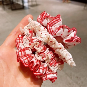 Set of red and white polka dot and plaid hair scrunchies with elegant lace trim details