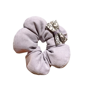 Sweet lilac floral fabric scrunchie with a small bow knot hair accessory for women