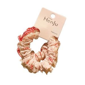 Vintage red plaid hair scrunchie with lace trim and sweet bow patterns on white background