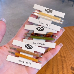 Detailed close-up of colorful acetate hair clips with stylish tortoiseshell patterns