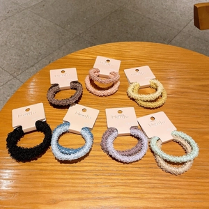 7-piece set of colorful plush elastic hair scrunchies on display cards for women
