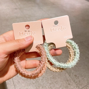 Elastic lace texture hair bands in pink and light blue on a card for girls