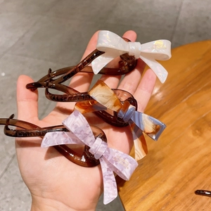 Élégante Pince Banane Nœud en Acétate de Cellulose Style Français Motif Marbre Écaille Accessoires de Cheveux Femme
