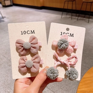Set of 4 handmade floral and corduroy bow hair clips for girls on display cards