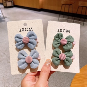 Handmade 10cm floral and bow hair clips in light blue and dark green cotton fabric