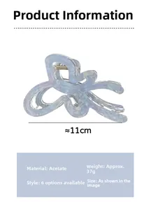 Macro detail of a 11cm blue marble acetate hair claw clip with its product dimensions