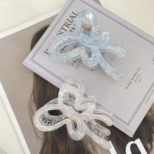 Elegant jelly butterfly hair claws in pearl white and blue for sophisticated updo styles