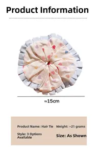 Detail of 15cm oversized scrunchie with colorful hearts and blue ruffled lace trim