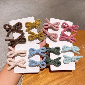 Cute faux lamb wool bow hair clips set for girls in various warm winter colors