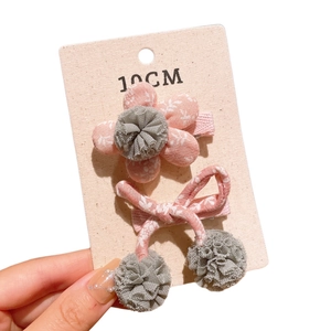 Floral fabric hair clip set with pink flower and bow on display card for children