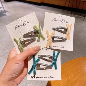 Lot de trois barrettes à nœuds en velours pour filles en vert, orange et bleu