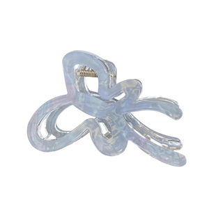 Iridescent blue butterfly hair claw clip with pearlescent finish for elegant hairstyles