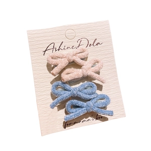 Set of 4 cute faux lamb wool bow hair clips in pastel pink and blue colors