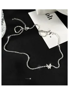 Detailed macro shot of S925 sterling silver butterfly pendant with shimmering micro-pave crystals
