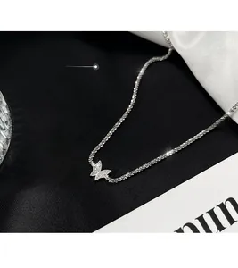 Detail of 925 silver necklace featuring a sparkling butterfly pendant with micro-pave stones