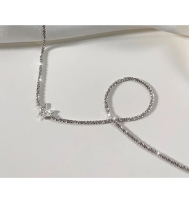Detail of 925 sterling silver butterfly pendant with sparkling cubic zirconia inlay