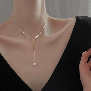 Elegant gold-tone Y-shaped pearl necklace for women featuring a minimalist drop pendant