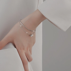 Elegant s925 sterling silver double-layer bracelet with a minimalist diamond ring charm