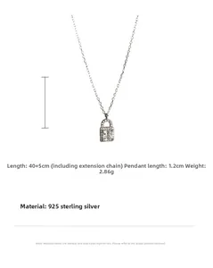 Macro view of 925 sterling silver lock necklace pendant with sparkling zircon inlay